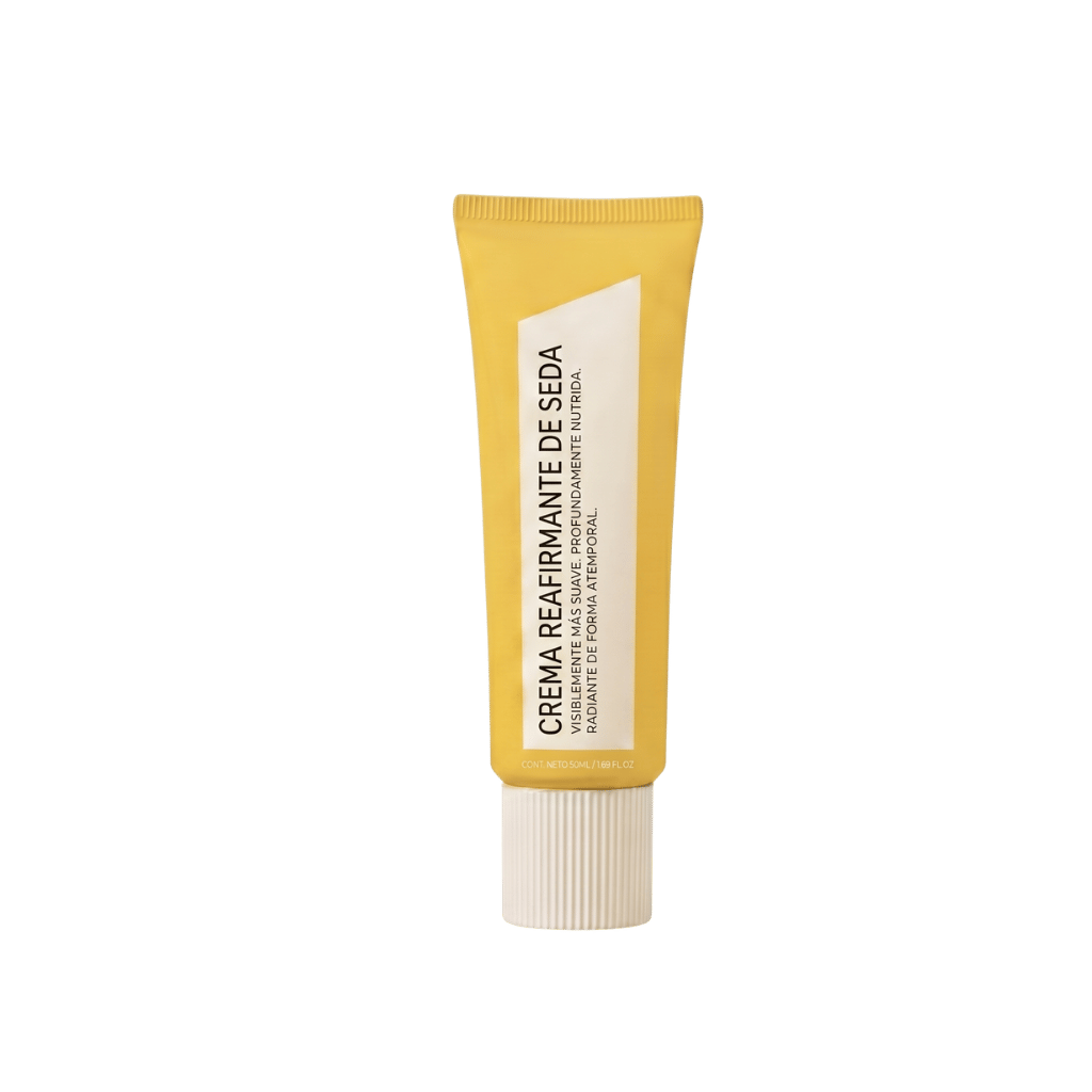 Crema Reafirmante de Seda en tubo amarillo, ideal para lograr una piel más firme y suave.